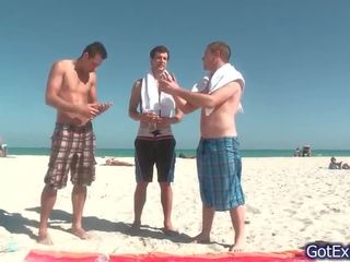 Outstanding gay threesome having fun under