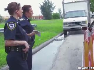 Female cops pull over black suspect and suck his penis